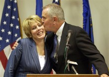 Jim Gibbons, right, kisses his wife Dawn, during a news conference in Las Vegas in a pathetic attempt at public fidelity.